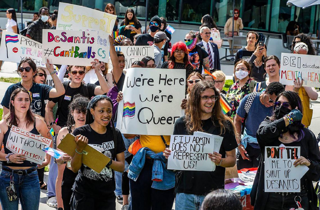 A group of Florida International University students, staff and community members participate in the Fight for Florida Students and Workers protest against Gov. Ron DeSantis