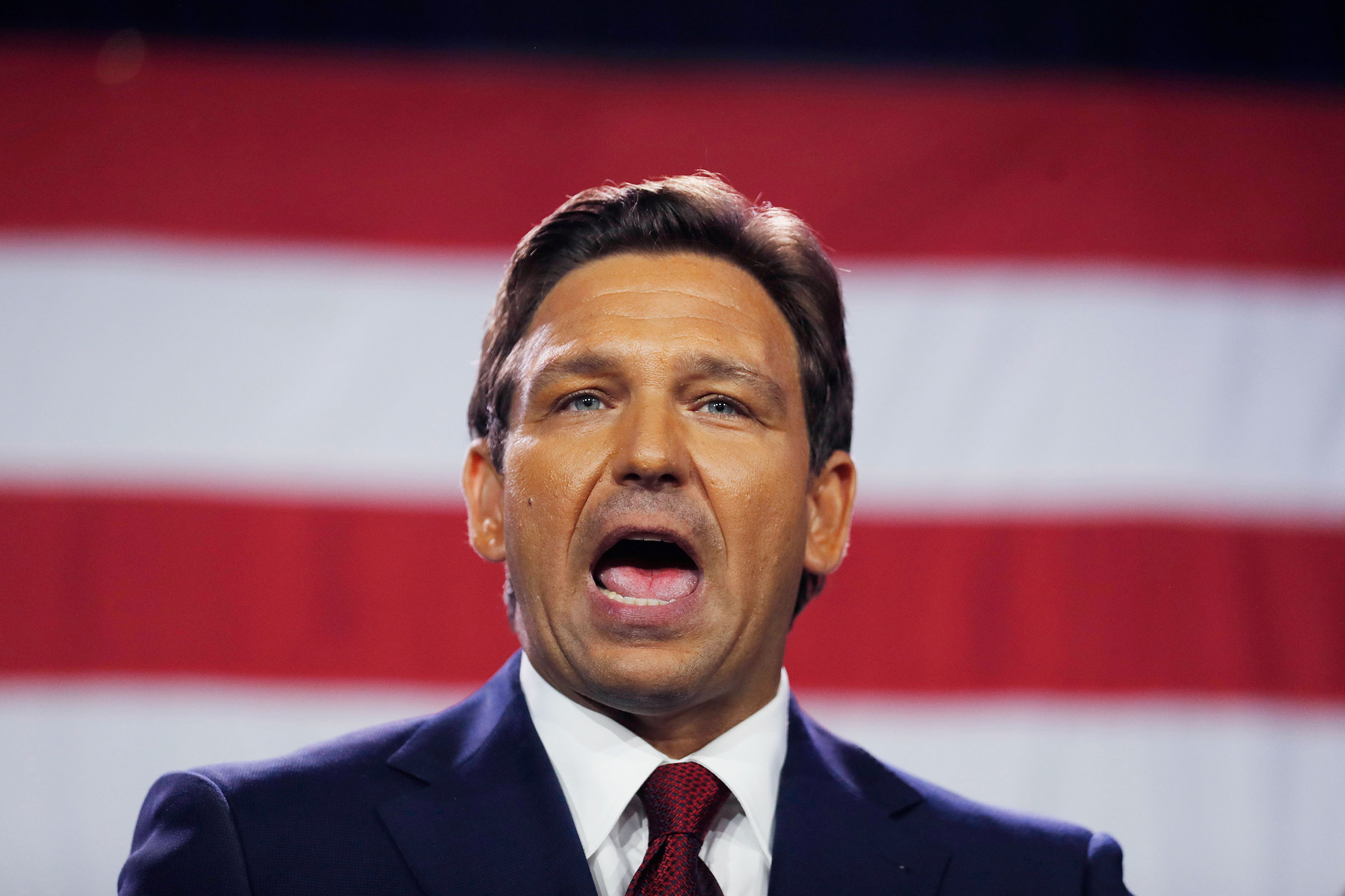 Ron Desantis speaks in front of the u.s. flag