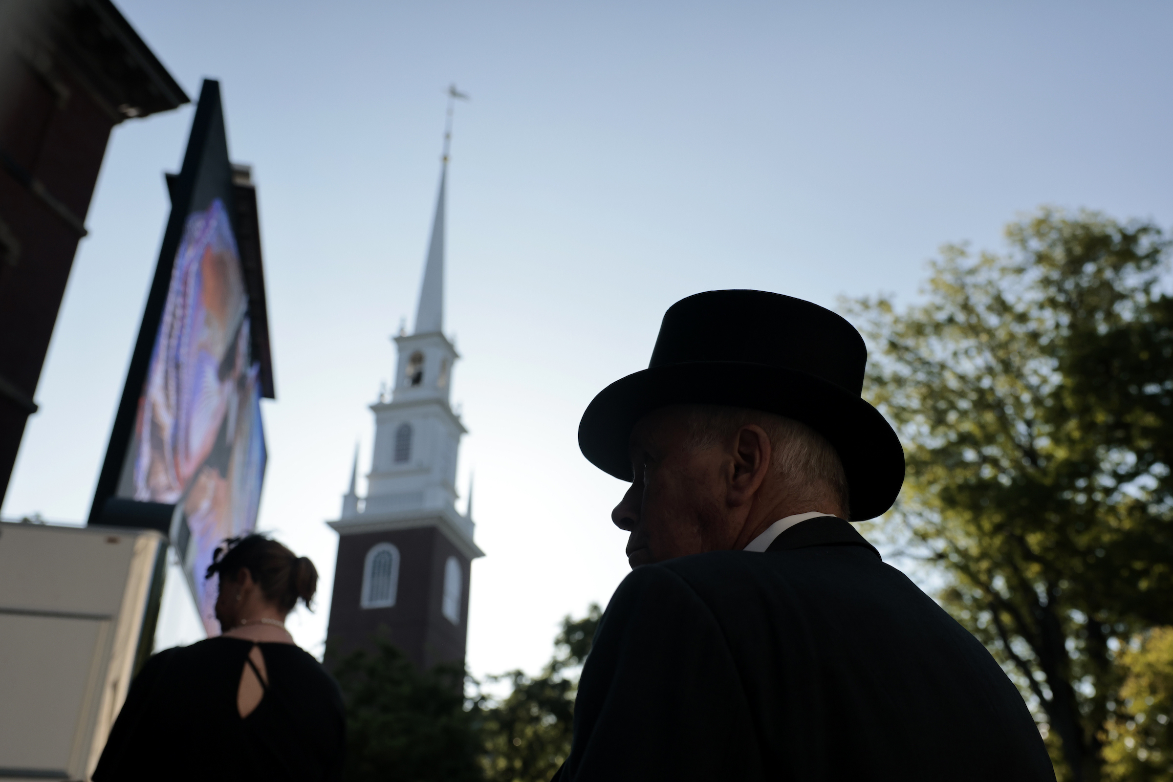 Alum Thomas Black greets guests during the 372nd Commencement at Harvard University.