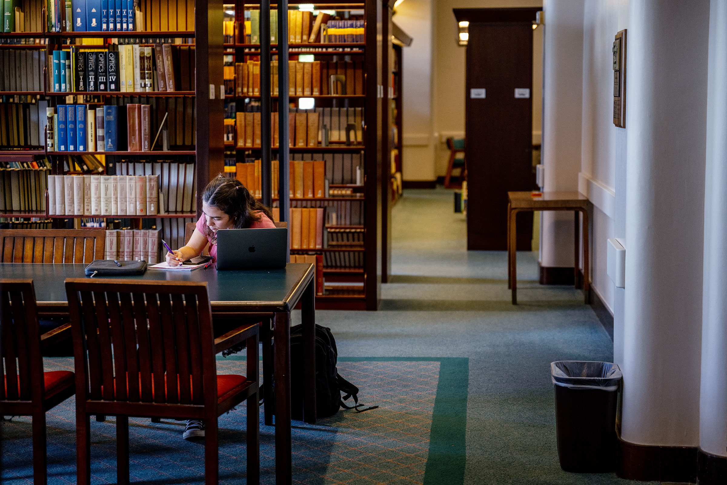 A student studies in a library