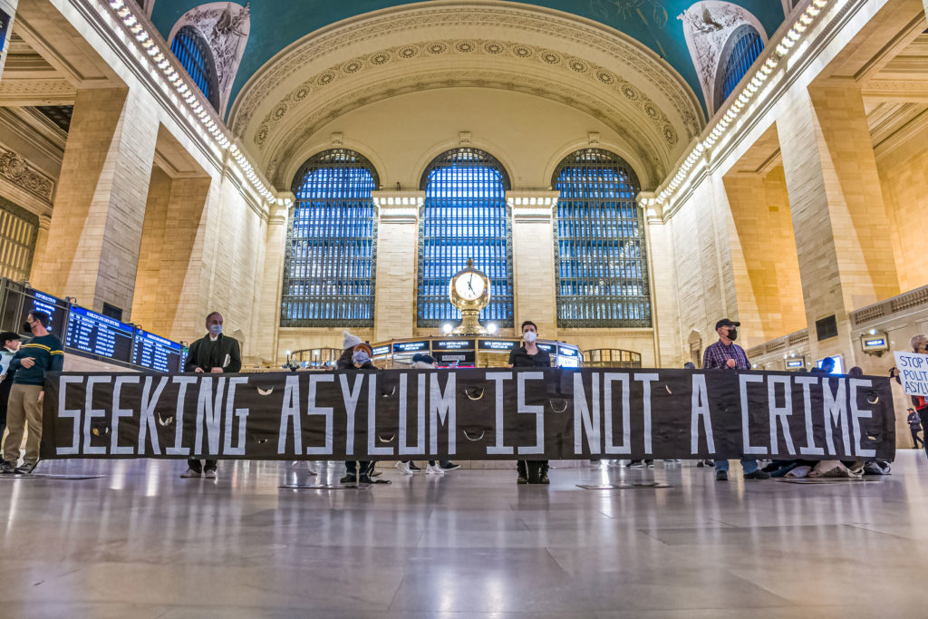 People display a banner reading