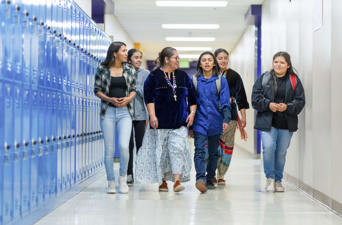 Indigenous students walk through the halls of Monument Valley High School in the Navajo Nation in Arizona