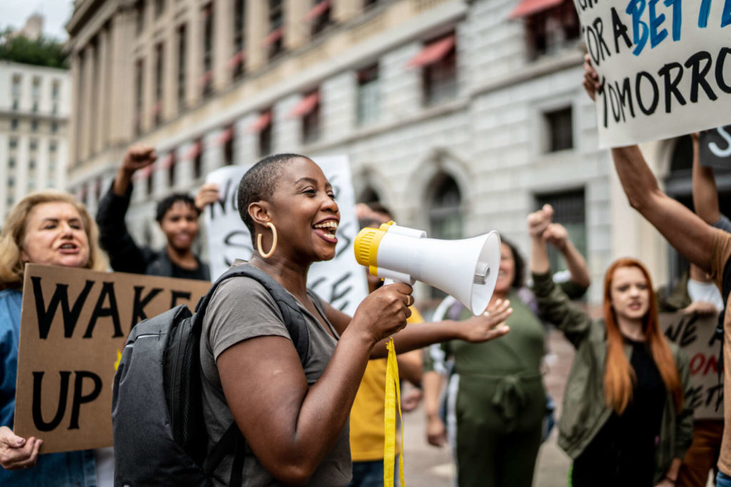 Activists doing a demonstration outdoors