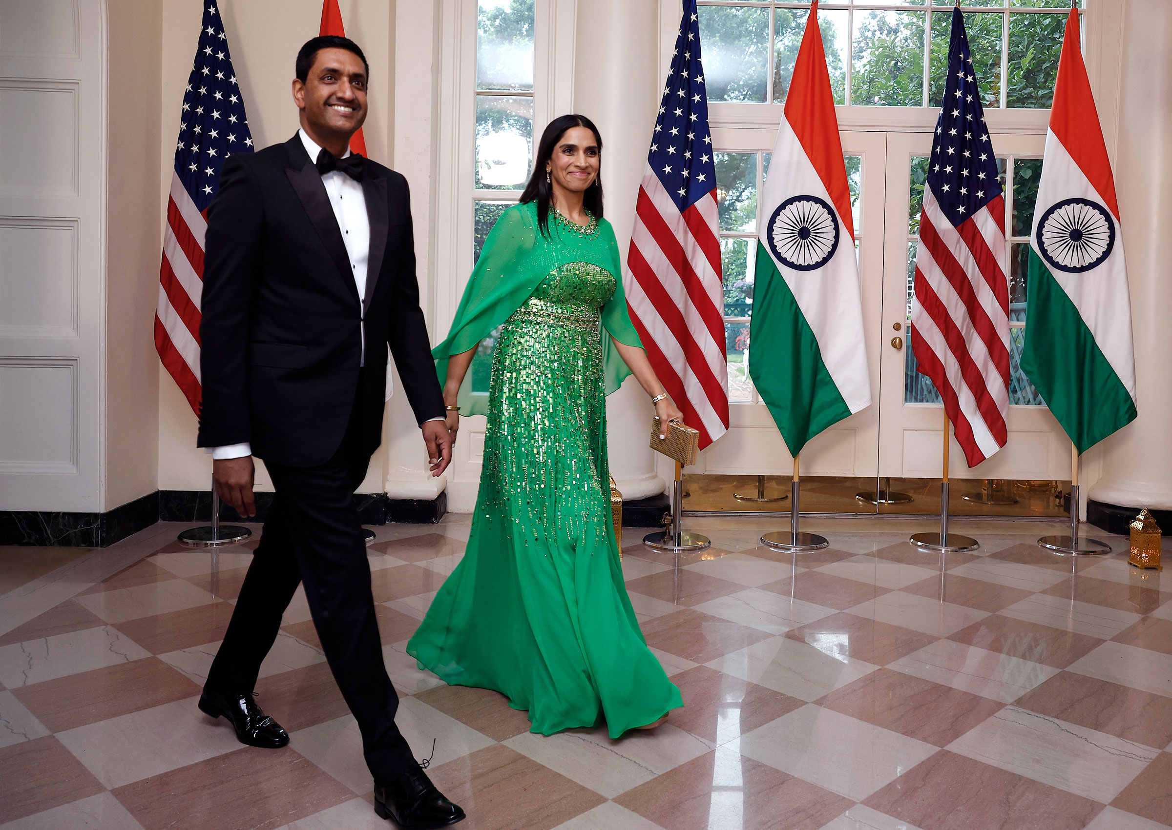 Ro Khanna enters an event holding his wife