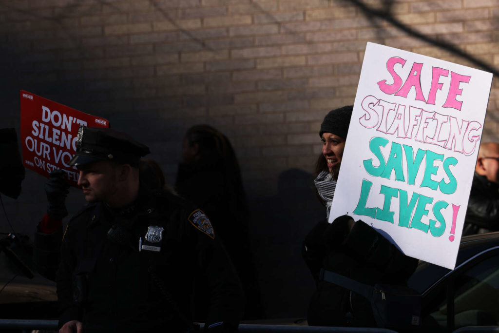 Nurses from Mount Sinai Hospital strike outside the hospital on January 9, 2023, in New York City.