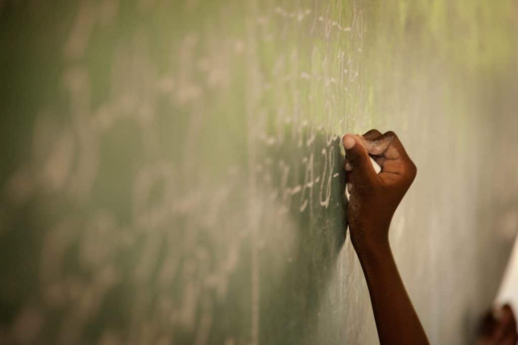 Hand writing on chalkboard