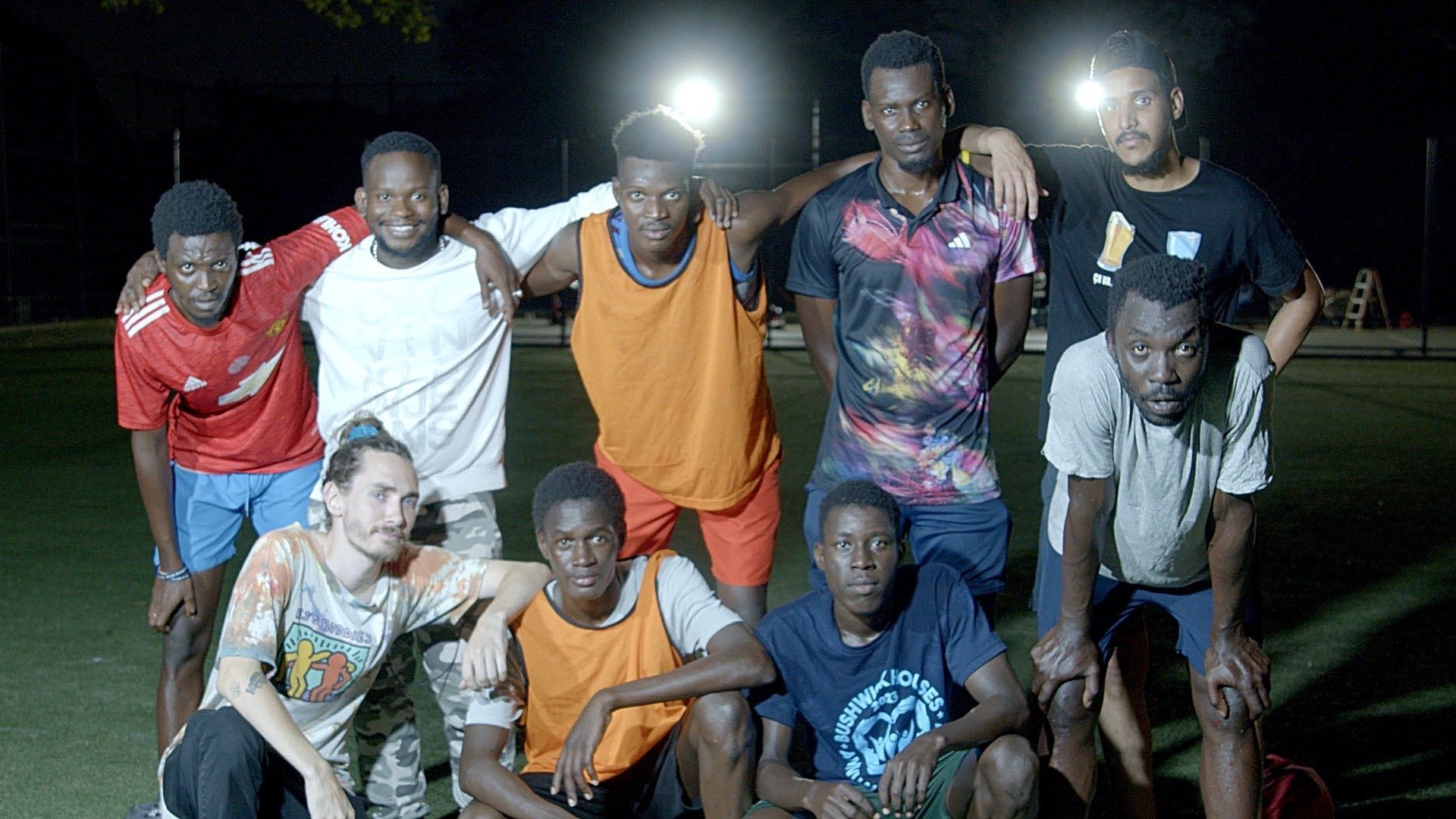Asylum seekers from Mauritania pose for a photo after a Wednesday night scrimmage in September 2023 at Grover Cleveland Park in Ridgewood Queens.