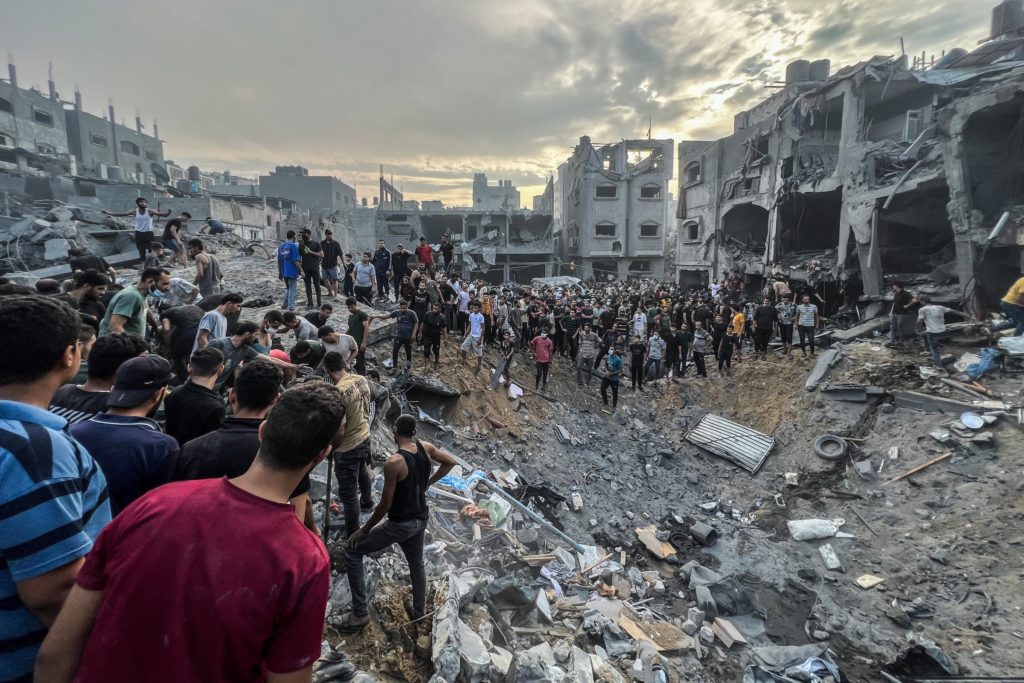 A screen grab from a video shows Palestinians searching for survivors following an Israeli airstrike in the Jabalia refugee camp north of Gaza City.