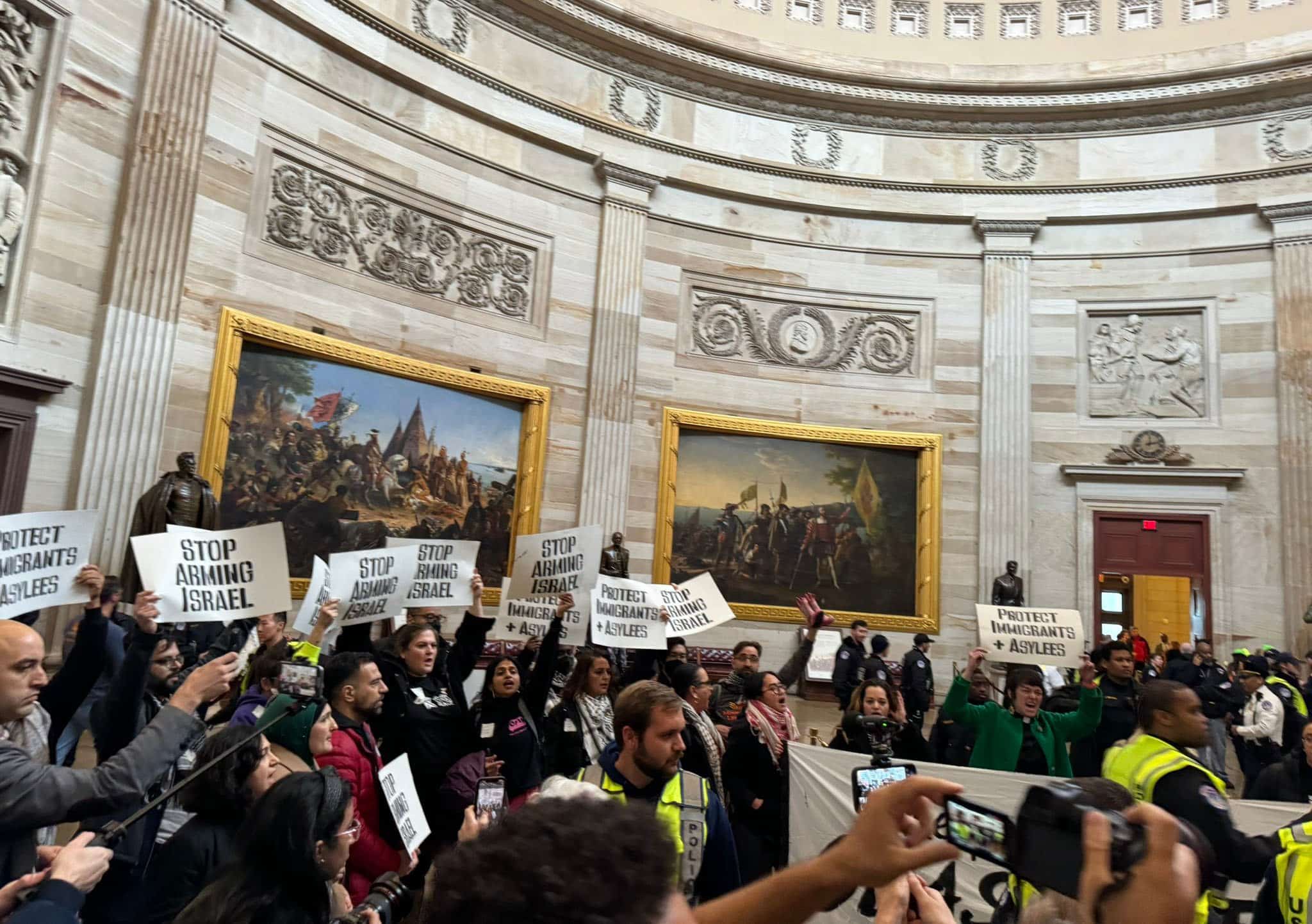 Protesters enter the U.S. Capitol in Washington, D.C. on December 19, 2023, to demand an immediate ceasefire in Gaza and an end to anti-migrant U.S. policies and practices.
