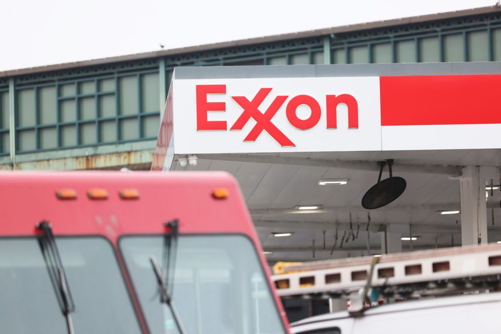 A truck is seen outside of an exxon mobil gas station