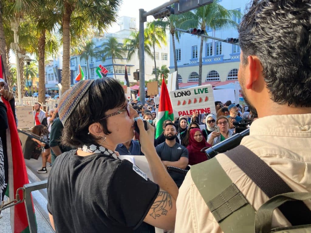 Nicole Morse speaks on behalf of Jewish Voice for Peace South Florida at a march organized by the South Florida Coalition for Palestine on November 11 in South Beach, Miami.