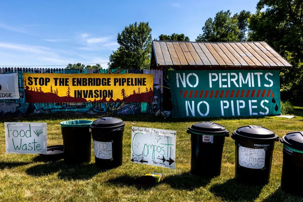 Waste segregation bins are seen in the campsite on the White Earth Nation Reservation near Waubun, Minnesota, on June 5, 2021.