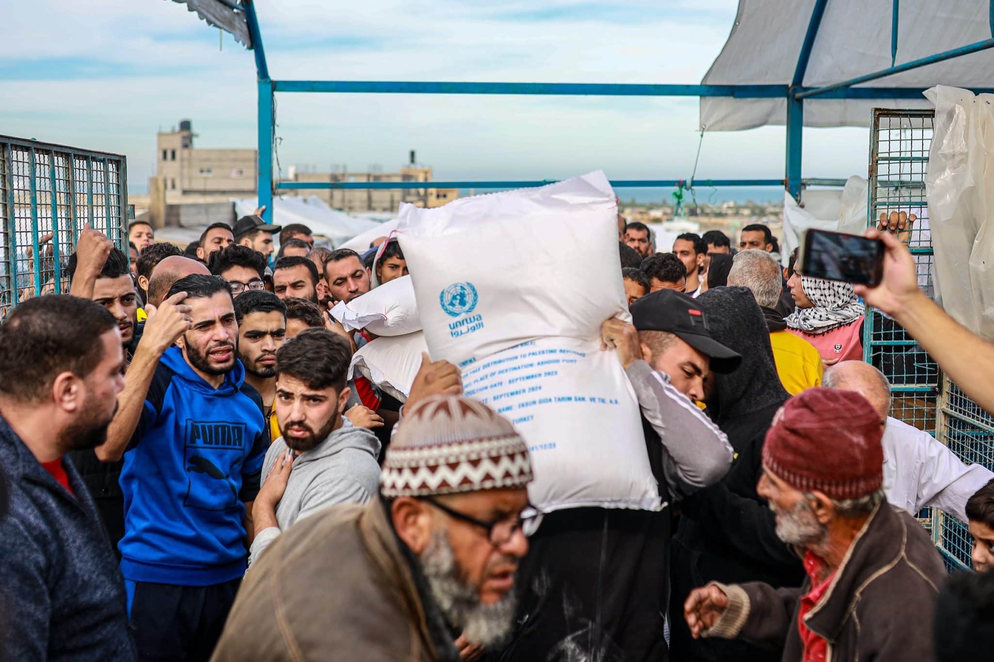 Flour is being distributed in Khan Yunis by the UNRWA to Gazans who had difficulty finding bread due to Israeli attacks, on November 22, 2023 in Gaza.