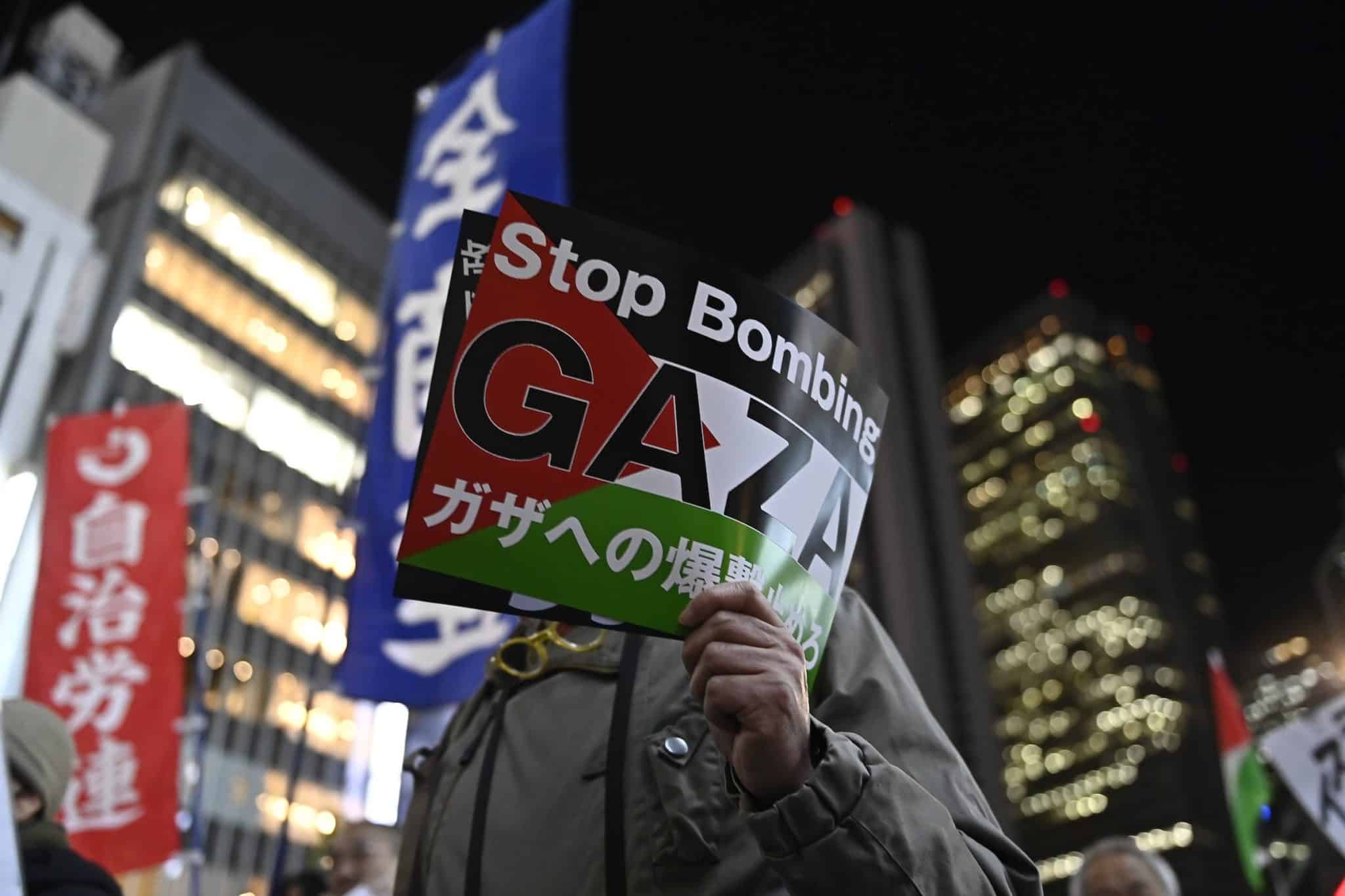 People gather and demonstrate on the street to express their solidarity with Palestinian people as part of the International Day of Solidarity with the Palestinian people in Tokyo, Japan, on November 29, 2023.