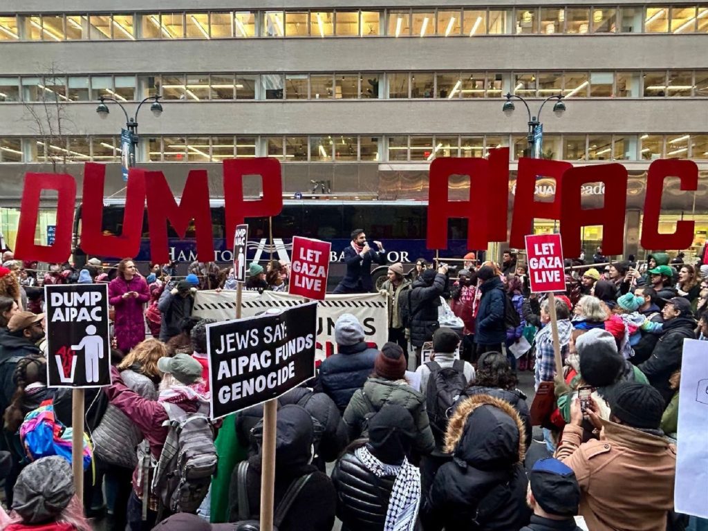 Jewish Voice for Peace protesters and their allies, many holding signs, demonstrate outside the American Israel Public Affairs Committee (AIPAC) headquarters in New York City on February 22, 2024, calling for a permanent ceasefire in Gaza.